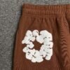 DENIM TEARS COTTON WREATH SWEATPANTS BROWN