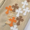 CHROME HEARTS ORANGE BROWN CROSS PATCH JEANS BEIGE