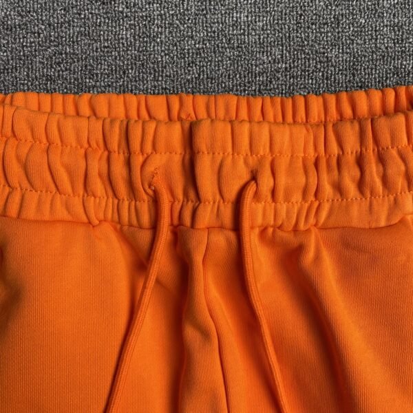 DENIM TEARS COTTON WREATH SWEATPANTS ORANGE