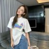 Gucci White T-Shirt with Pink Dinosaur Graphic