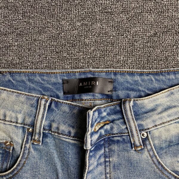 AMIRI VARSITY LOGO JEANS