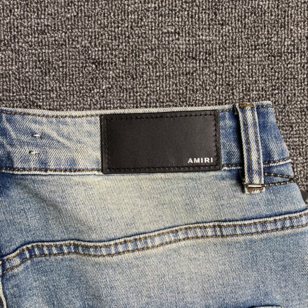 AMIRI VARSITY LOGO JEANS