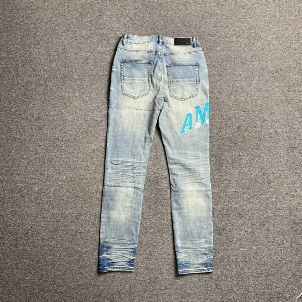 AMIRI VARSITY LOGO JEANS