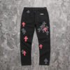 CHROME HEARTS PINK & CHECKERED CROSS PATCH FLEURKNEE JEANS BLACK