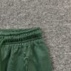DENIM TEARS COTTON WREATH SWEATPANTS GREEN