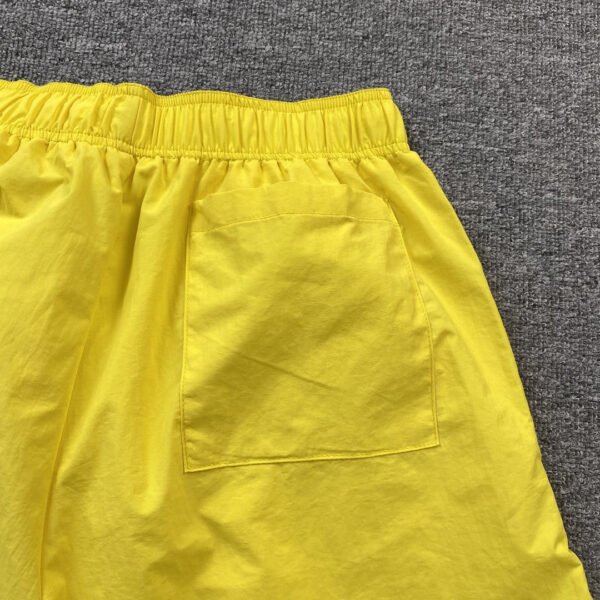 SP5DER DOUBLE LAYER SHORTS YELLOW