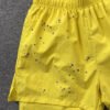 SP5DER DOUBLE LAYER SHORTS YELLOW