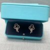 18K T Keys Woven Diamond Earrings