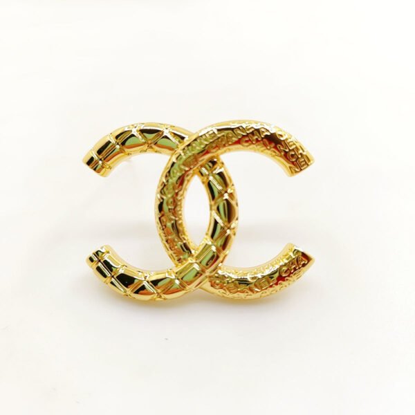 18K CC 24S Brooch