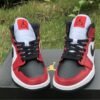JORDAN 1 MID x CHICAGO BLACK TOE